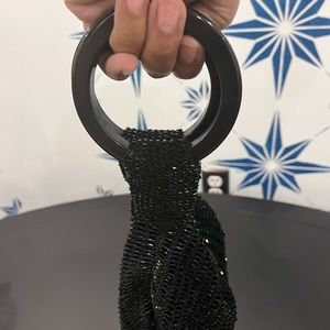 Black beaded black label clutch by Akira